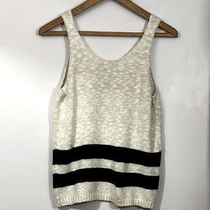 A loves a medium acrylic blend knit shell.  Soft fabric is off white with black